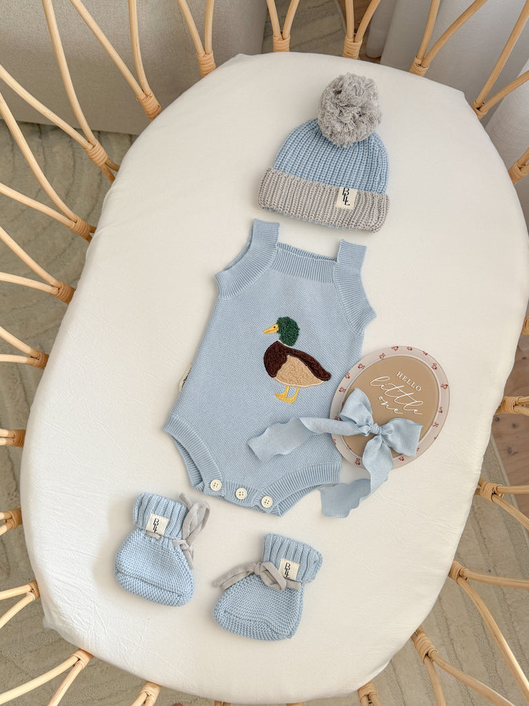 Little Mallard Knit Romper flat lay showing relaxed fit and cotton knit texture — Brave Little Lamb