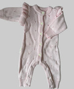 Pink knitted baby romper with long sleeves 